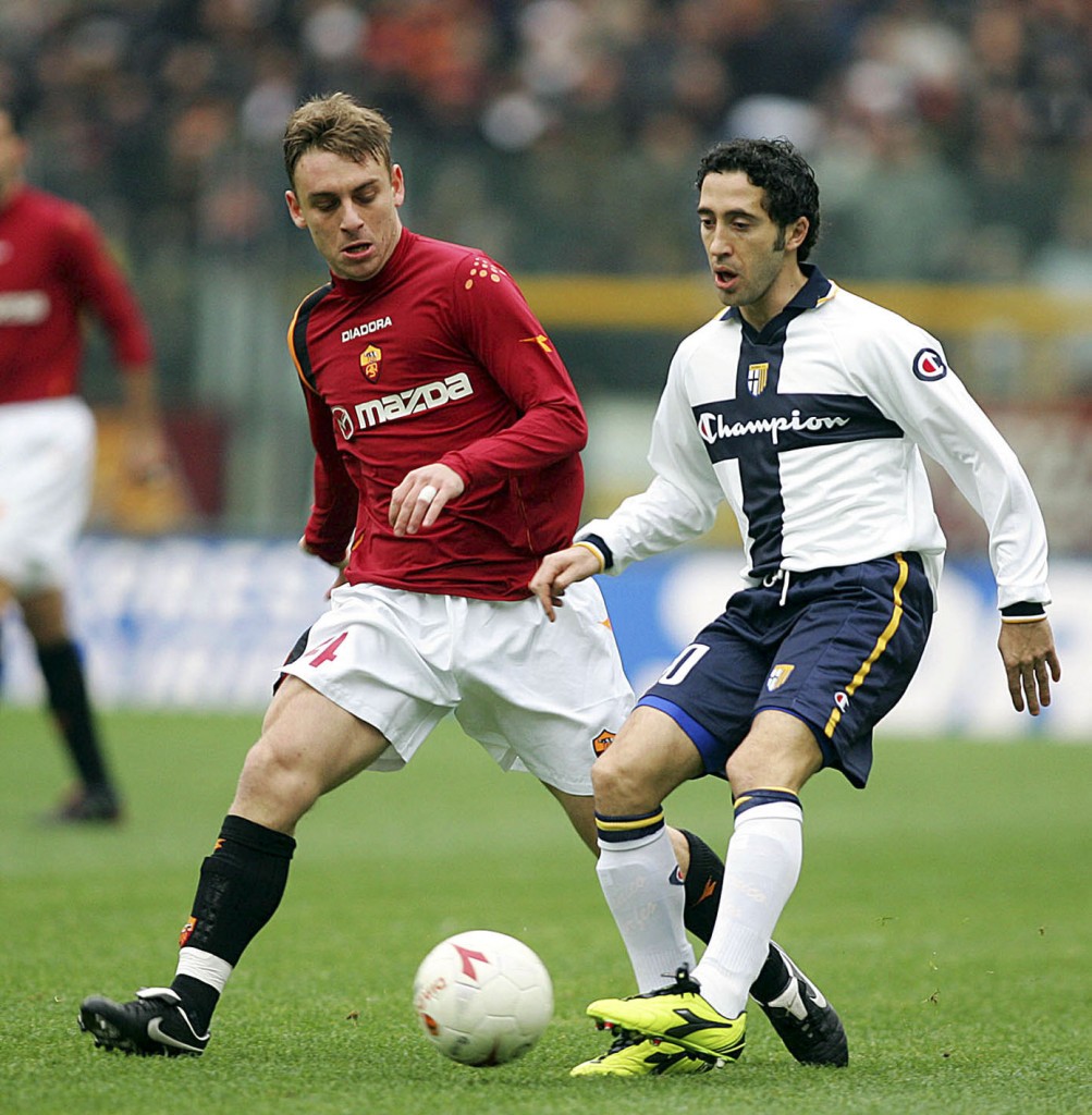 ROME, ITALY - DECEMBER 19: Daniele de Rossi of Roma (L) and Domenico Morfeo of Parma in action during the Serie A match between Roma and and Parma at the Olympic stadium on December 19, 2004 in Rome, Italy. (Photo by Newpress/Getty Images)