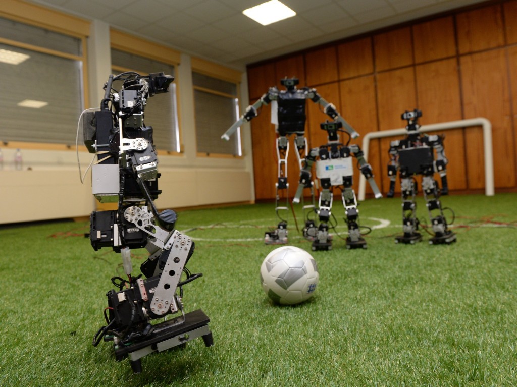 TO GO WITH AFP STORY BY LAURENT BANGUET - Robots play football at the LABRI Laboratory (computer science research center) in Bordeaux on July 3, 2015. These robots will defend the colors of France in the next World Robotics competition 'RoboCup' , held in China from July 19 to 23. AFP PHOTO / JEAN PIERRE MULLER (Photo credit should read JEAN-PIERRE MULLER/AFP/Getty Images)