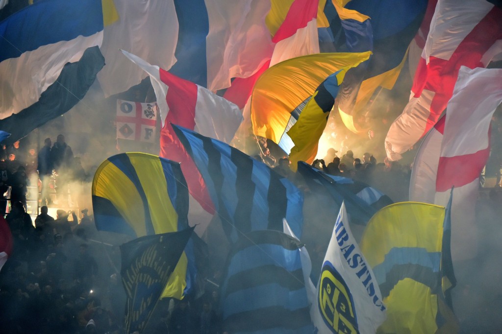 Inter Milan's supporters wave flags during the Italian Serie A football match between AC Milan and Inter Milan at San Siro Stadium in Milan on January 31, 2016. / AFP / GIUSEPPE CACACE (Photo credit should read GIUSEPPE CACACE/AFP/Getty Images)