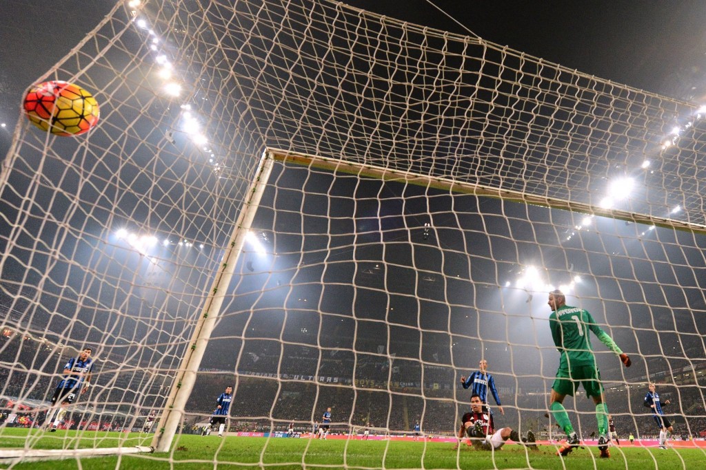 AC Milan's Colombian forward Carlos Bacca (C, down) scores a goal during the Italian Serie A football match between AC Milan and Inter Milan at San Siro Stadium in Milan on January 31, 2015. / AFP / GIUSEPPE CACACE (Photo credit should read GIUSEPPE CACACE/AFP/Getty Images)