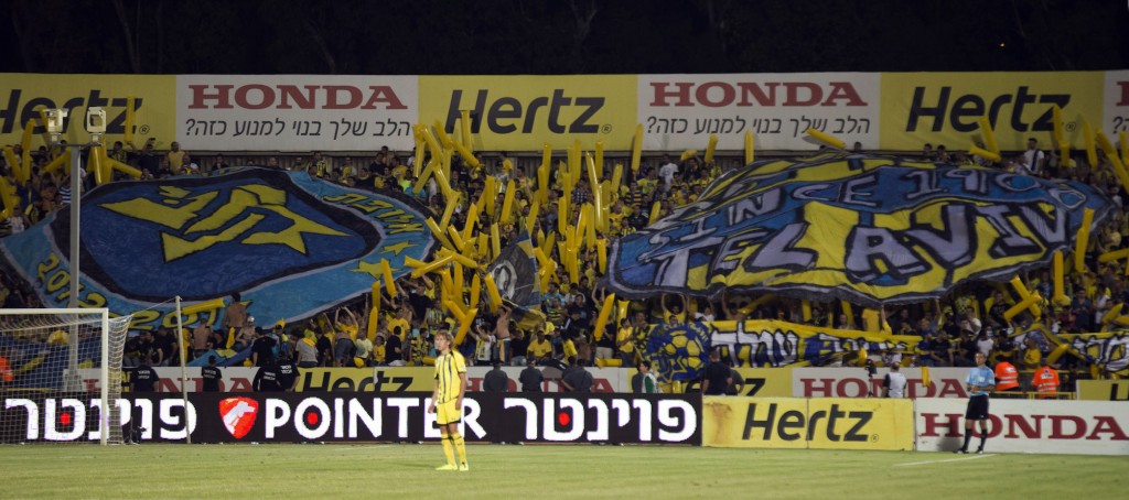 Maccabi Tel Aviv's fans during their Israeli Winner League football match between Maccabi Tel Aviv and Maccabi Haifa at Kiryat Eliezer Stadium in the Mediterrannean costal city of Haifa north of Israel, on April 29, 2013. AFP PHOTO / JACK GUEZ