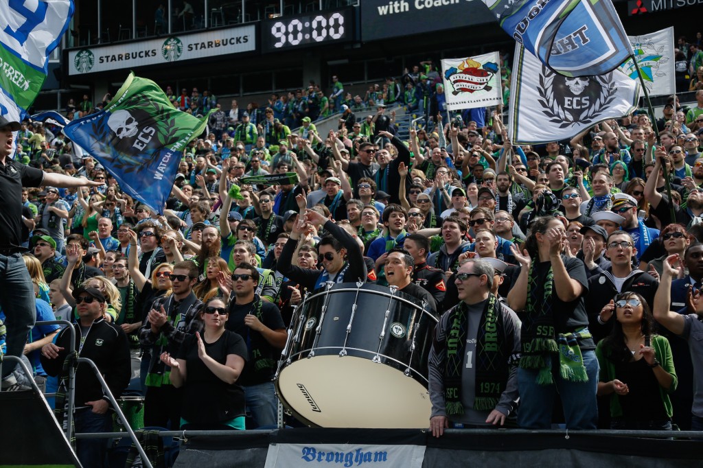 SEATTLE, WA - APRIL 26: Fans cheer during the match between the Seattle Sounders FC and the Colorado Rapids at CenturyLink Field on April 26, 2014 in Seattle, Washington. The Sounders defeated the Rapids 4-1. (Photo by Otto Greule Jr/Getty Images) *** Local Caption *** Fans