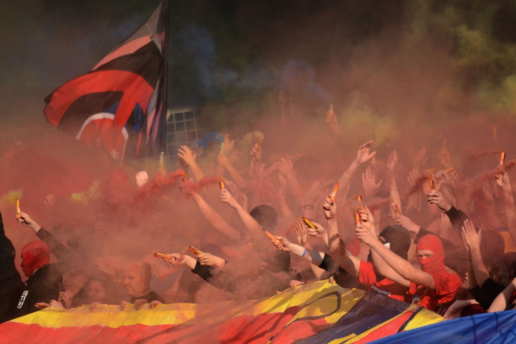 Sparta Prague fans celebrate during the match between their team and FK Vysocina Jihlava on May 31, 2014 at the Generali Arena, in Prague. Sparta defeated Jihlava 4-1 and won the first place in the Czech Republic football league and their 12nd title since the national league was formed in 1993. AFP PHOTO/MICHAL CIZEK (Photo credit should read MICHAL CIZEK/AFP/Getty Images)