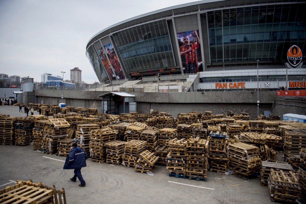 Empty pallets are seen outside the Donbass Stadium, home of the Shaktar Donetsk football club on April 14, 2015 in Donetsk, in the self-proclaimed Donetsk People's Republic (DNR). The football club which was knocked out of the Champions League in the round of 16 is distributing food parcels from the now idle stadium. The club's owner Ukrainian oligarch Renat Akhmetov through his foundation have 2,000 volunteers delivering some 20,000 food parcels a day for people in need from 29 distribution centers across the Donetsk region. AFP PHOTO / ODD ANDERSEN (Photo credit should read ODD ANDERSEN/AFP/Getty Images)