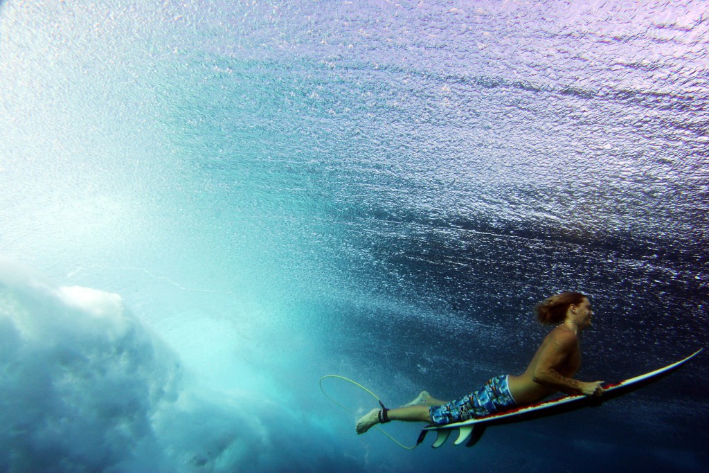 KAPALUA, HI - JANUARY 5: A surfer duck dives a wave at Windmills during large storm surf in Hawaii January 6, 2005 in Kapalua, Maui, Hawaii. (Photo by Donald Miralle/Getty Images)