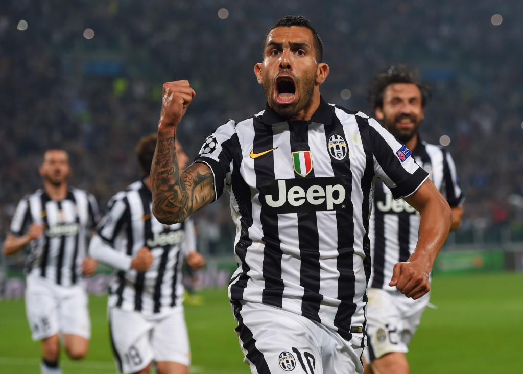 Carlos Tevez esulta dopo un suo gol al Real Madrid, lo scorso anno (Photo by Michael Regan/Getty Images)