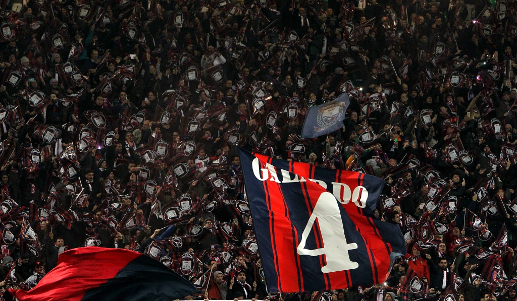 MILAN, ITALY - DECEMBER 01: The FC Crotone fans show their support before the TIM Cup match between AC Milan and FC Crotone at Stadio Giuseppe Meazza on December 1, 2015 in Milan, Italy. (Photo by Marco Luzzani/Getty Images)