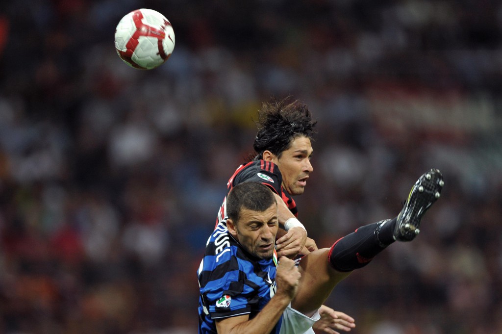 AC Milan's forward Marco Borriello (R) jumps for the ball with Inter Milan's Argentinian defender Walter Andrian Samuel during their Serie A football match AC Milan vs Inter Milan at San Siro Stadium in Milan on August 29, 2009. AFP PHOTO / GIUSEPPE CACACE (Photo credit should read GIUSEPPE CACACE/AFP/Getty Images)