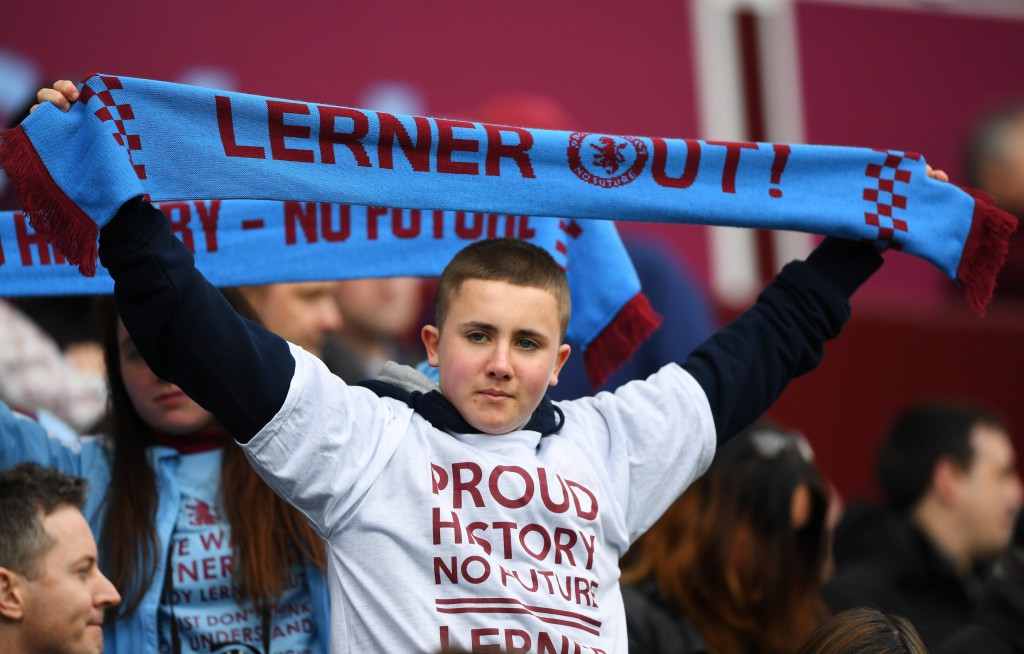 BIRMINGHAM, UNITED KINGDOM - APRIL 09: An Aston Villa supporter holds a banner protesting owner Randy Lerner prior to the Barclays Premier League match between Aston Villa and A.F.C. Bournemouth at Villa Park on April 9, 2016 in Birmingham, England. (Photo by Shaun Botterill/Getty Images)