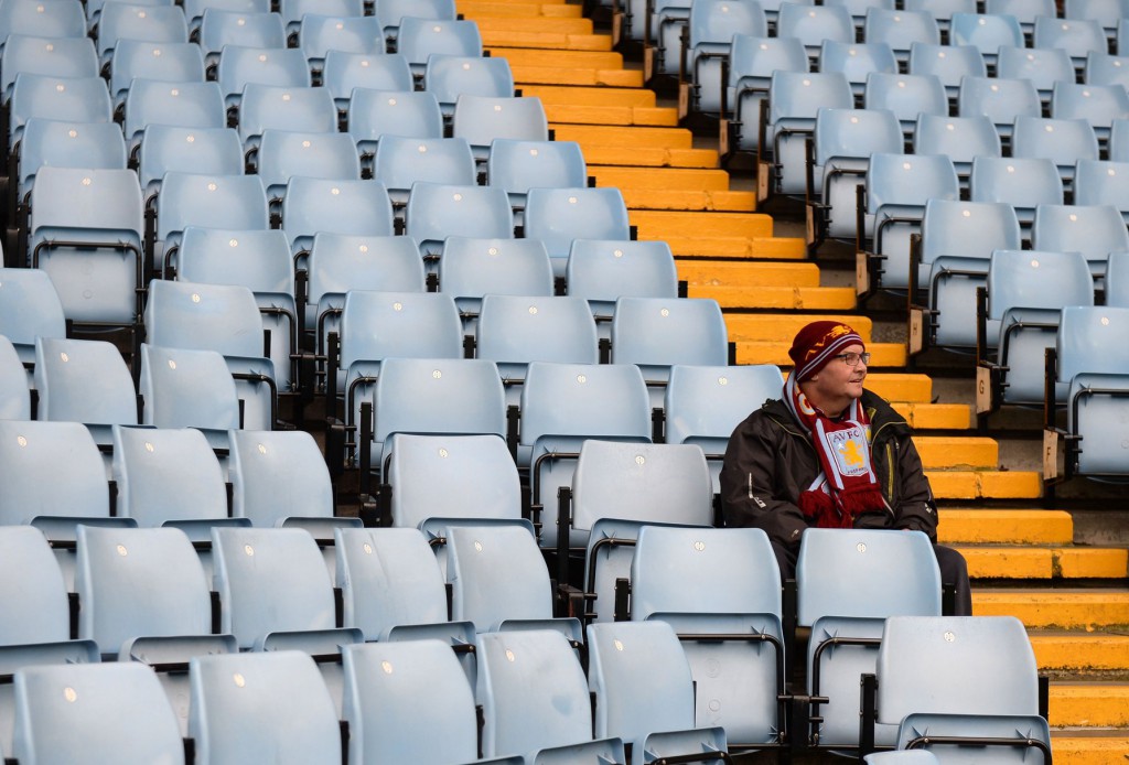 An Aston Villa supporter looks on before the English Premier League football match between Aston Villa and Chelsea at Villa Park in Birmingham, central England on April 2, 2016. / AFP / OLI SCARFF / RESTRICTED TO EDITORIAL USE. No use with unauthorized audio, video, data, fixture lists, club/league logos or 'live' services. Online in-match use limited to 75 images, no video emulation. No use in betting, games or single club/league/player publications. / (Photo credit should read OLI SCARFF/AFP/Getty Images)