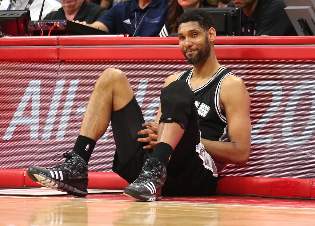 LOS ANGELES, CA - MAY 02: Tim Duncan #21 of the San Antonio Spurs as he sits by the scorer's table waiting to enter the game against the Los Angeles Clippers during Game Seven of the Western Conference quarterfinals of the 2015 NBA Playoffs at Staples Center on May 2, 2015 in Los Angeles, California. The Clippers won 111-109 to win the series four games to three. NOTE TO USER: User expressly acknowledges and agrees that, by downloading and or using this photograph, User is consenting to the terms and conditions of the Getty Images License Agreement. (Photo by Stephen Dunn/Getty Images)