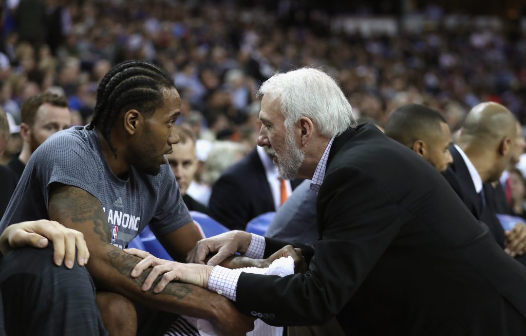 SACRAMENTO, CA - FEBRUARY 24: Head coach Gregg Popovich of the San Antonio Spurs talks to Kawhi Leonard #2 of the San Antonio Spurs during their game against the Sacramento Kings at Sleep Train Arena on February 24, 2016 in Sacramento, California. NOTE TO USER: User expressly acknowledges and agrees that, by downloading and or using this photograph, User is consenting to the terms and conditions of the Getty Images License Agreement. (Photo by Ezra Shaw/Getty Images)