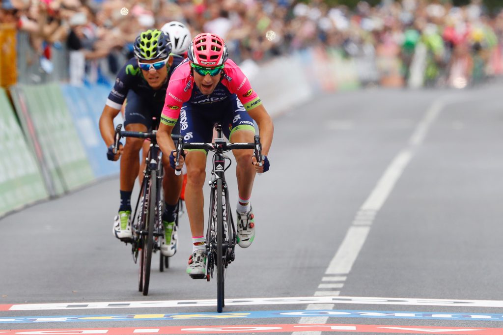 CORRECTION NATIONALITY OF THE RIDER - Italy's Diego Ulissi (front) of team Lampre-Merida sprints to win the 11th stage of the 99th Giro d'Italia, Tour of Italy, from Modena to Asolo on May 18, 2016. Ulissi won the stage ahead of Costa Rica's Andrey Amador of team Movistar and Pink jersey Luxembourg's rider Bob Jungels of Etixx - Quick Step. / AFP / Luk BENIES (Photo credit should read LUK BENIES/AFP/Getty Images)