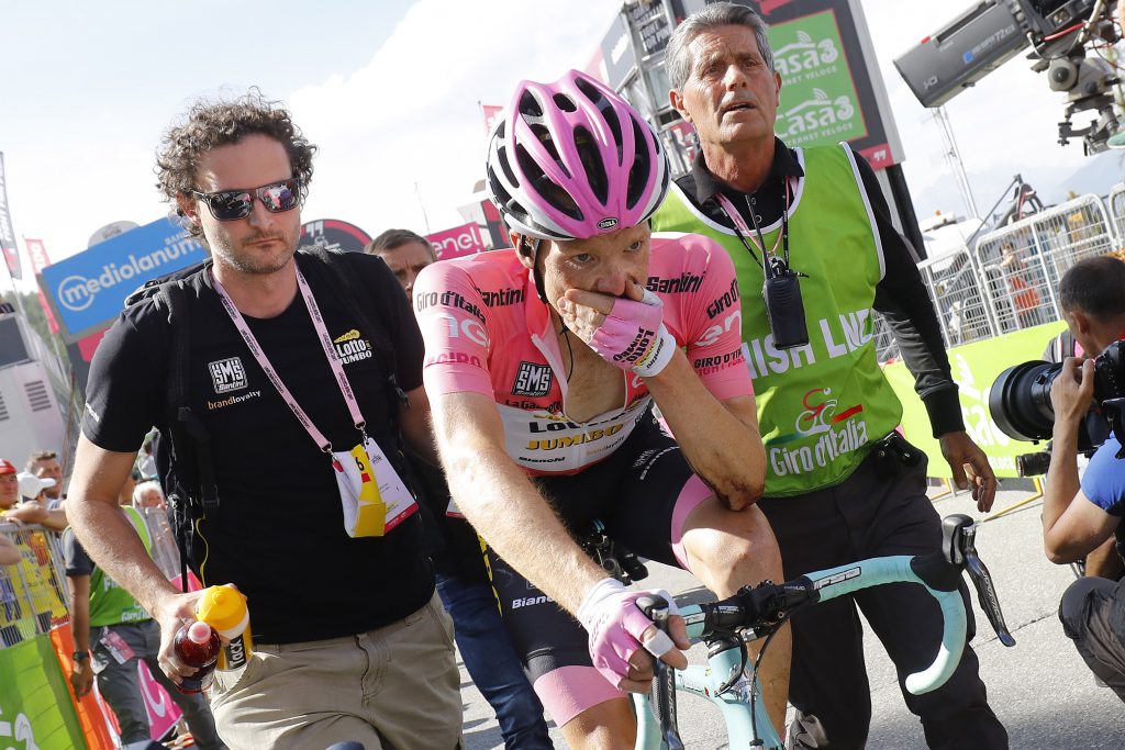 Pink jersey Dutch Steven Kruijswijk of team (Lotto NL) reacts after crossing the finish line of the 19th stage of the 99th Giro d'Italia, Tour of Italy, from Pinerolo to Risoul on May 27, 2016. Overnight leader Steven Kruijswijk finished almost five minutes off the pace after surviving a spectacular head-over-heels fall on the descent of the Col d'Agnel but then getting dropped badly on the last climb. Italy's Vincenzo Nibali of Astana escaped alone to a summit-finish victory in the 19th stage of the Giro d'Italia on Friday whilst Colombia's Esteban Chaves rode into the pink jersey by coming third on the day. / AFP / LUK BENIES (Photo credit should read LUK BENIES/AFP/Getty Images)