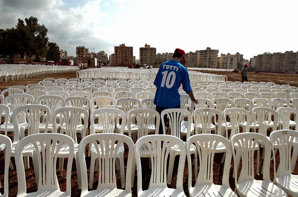 A Lebanese youth, wearing a T-shirt bear