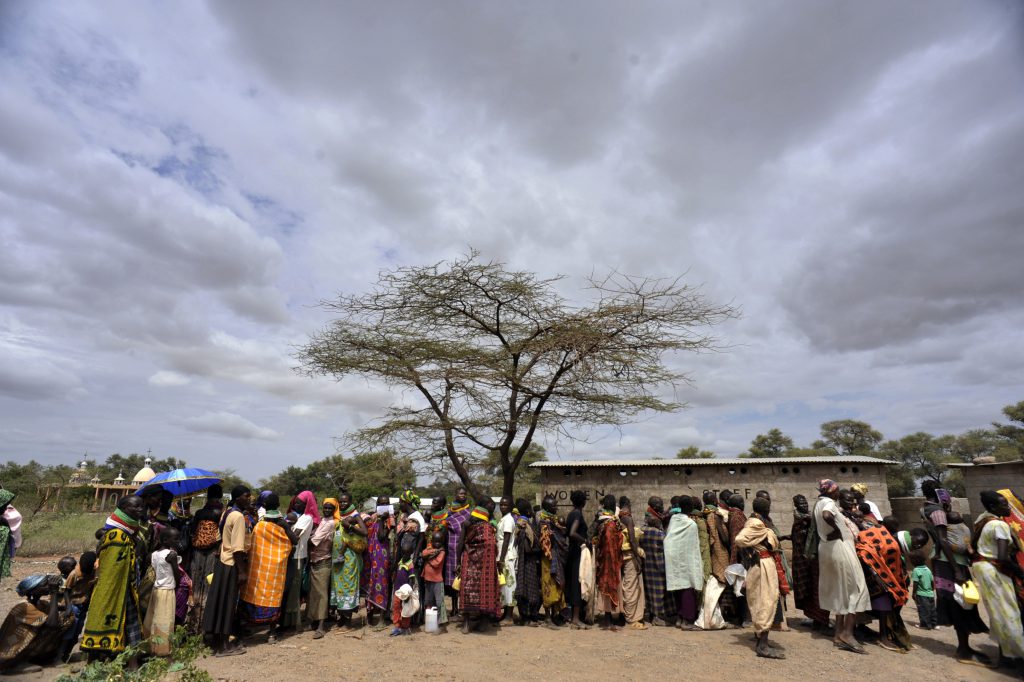 (FILES) - A file picture taken on August 8, 2011 shows Turkana women and children waiting for supplimentary feeding for infants at a relief and health centre in Kakuma, Turkana District, northwestern Kenya. Tens of thousands of refugees living in urban areas in Kenya must return to remote and overcrowded camps, the government said on December 18, 2012, demanding all aid be cut off outside the camps. AFP PHOTO / SIMON MAINA (Photo credit should read SIMON MAINA/AFP/Getty Images)