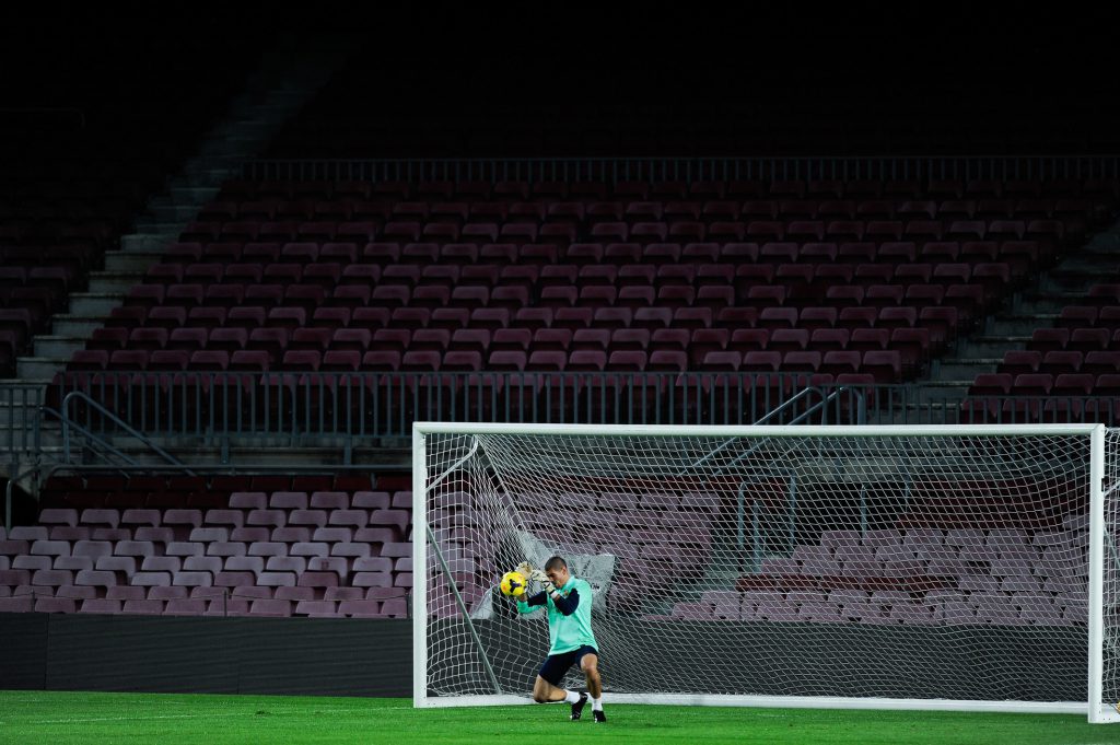 BARCELONA, SPAIN - OCTOBER 25: Victor Valdes of FC Barcelona blocks the ball during a training session at the Camp Nou Stadium on October 25, 2013 in Barcelona, Spain. (Photo by David Ramos/Getty Images)