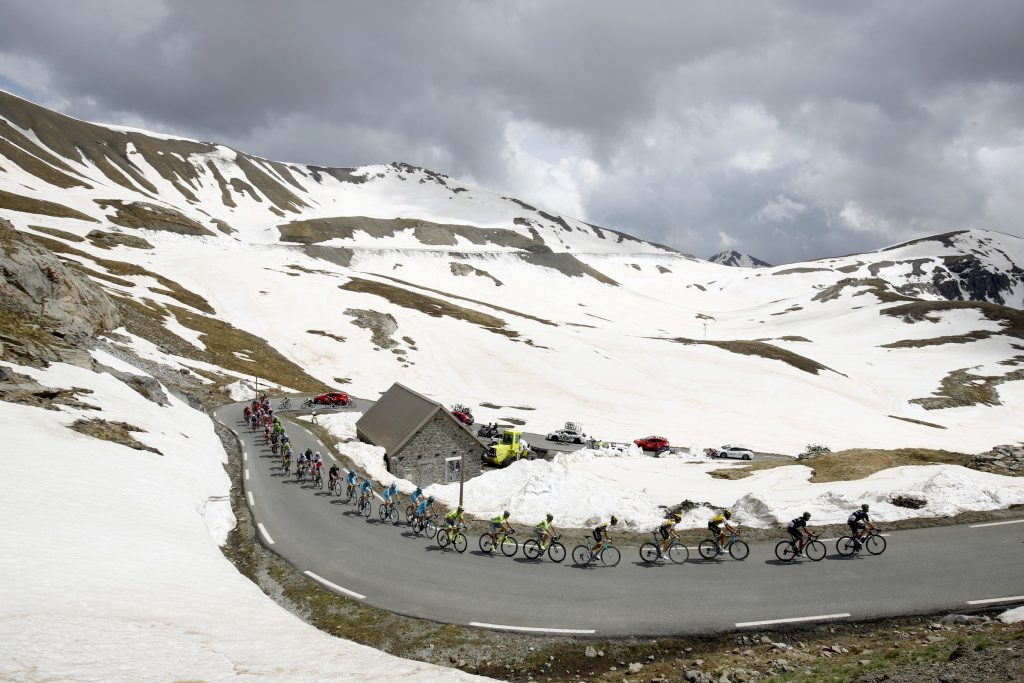 The peloton rides at the La Bonette pass (Col de la Bonette) during the 20th stage of the 99th Giro d'Italia, Tour of Italy, from Guillestre to Sant'Anna di Vinadio on May 28, 2016. Starting the day second at 44sec behind leader Esteban Chaves, Italian Vincenzo Nibali puts 1min 35sec into the Colombian to snatch the pink jersey. / AFP / LUK BENIES (Photo credit should read LUK BENIES/AFP/Getty Images)