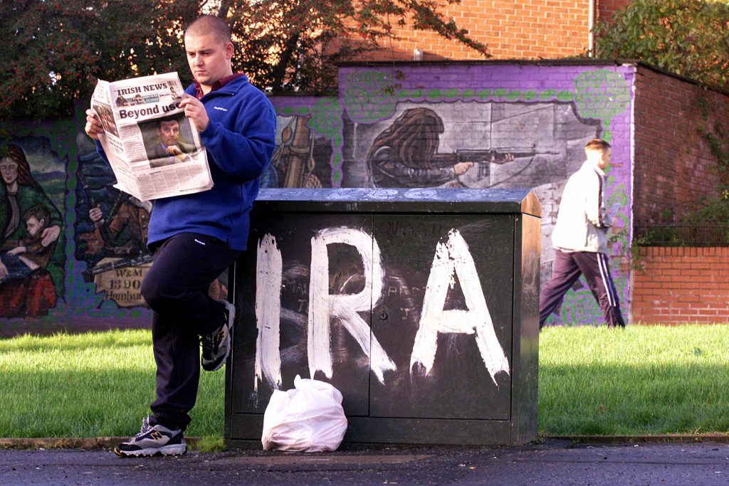 396347 01: A resident reads a local newspaper October 24, 2001 in Andersontown in West Belfast, Northern Ireland. General John de Chastelain, head of the Independent International Commission on Decommissioning, said October 22 he wants his party to rejoin Northern Ireland's ruling coalition after IRA guerrillas made a groundbreaking disarmament move. (Photo by Cathal McNaughton/Getty Images)