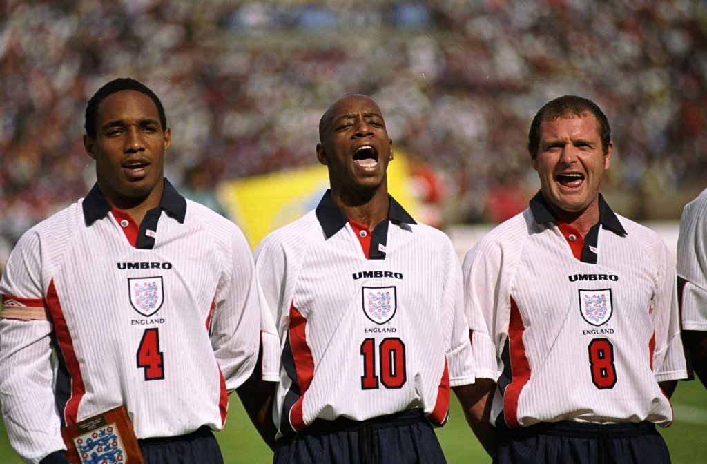 27 May 1998: Captain, Paul Ince of England and Liverpool sings the National Anthem with fellow team-mates Ian Wright and Paul Gascogne during the match between Morocco v England in the King Hassan II Cup played in Casablanca, Morocco. England won the match 1-0. Mandatory Credit: Shaun Botterill /Allsport