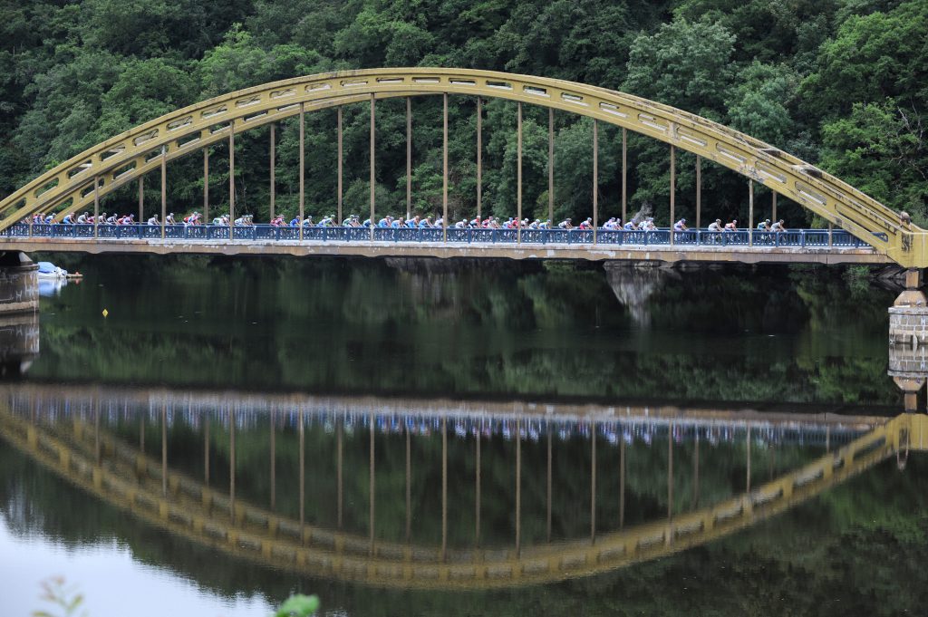 The pack rides on July 14, 2009 during the 193 km and teenth of the 2009 Tour de France cycling race run between Limoges and Issoudun. AFP PHOTO PATRICK HERTZOG (Photo credit should read PATRICK HERTZOG/AFP/Getty Images)