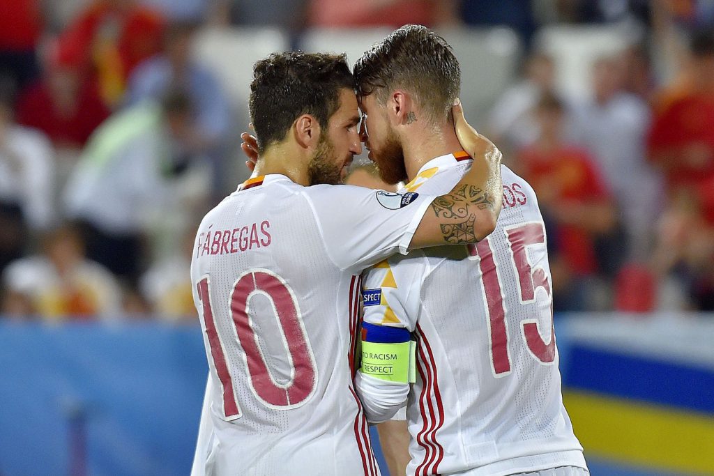 Spain's midfielder Cesc Fabregas (L) speaks with Spain's defender Sergio Ramos before his penalty during the Euro 2016 group D football match between Croatia and Spain at the Matmut Atlantique stadium in Bordeaux on June 21, 2016. / AFP / LOIC VENANCE (Photo credit should read LOIC VENANCE/AFP/Getty Images)