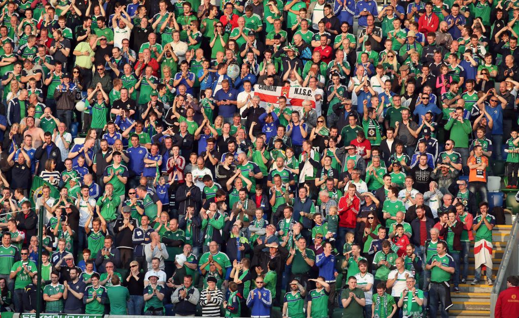 Northern Ireland's fans celebrate the second goal against Belarus during an international friendly football match between Northern Ireland and Belarus at Windsor Park in Belfast, Northern Ireland, on May 27, 2016. / AFP / PAUL FAITH (Photo credit should read PAUL FAITH/AFP/Getty Images)