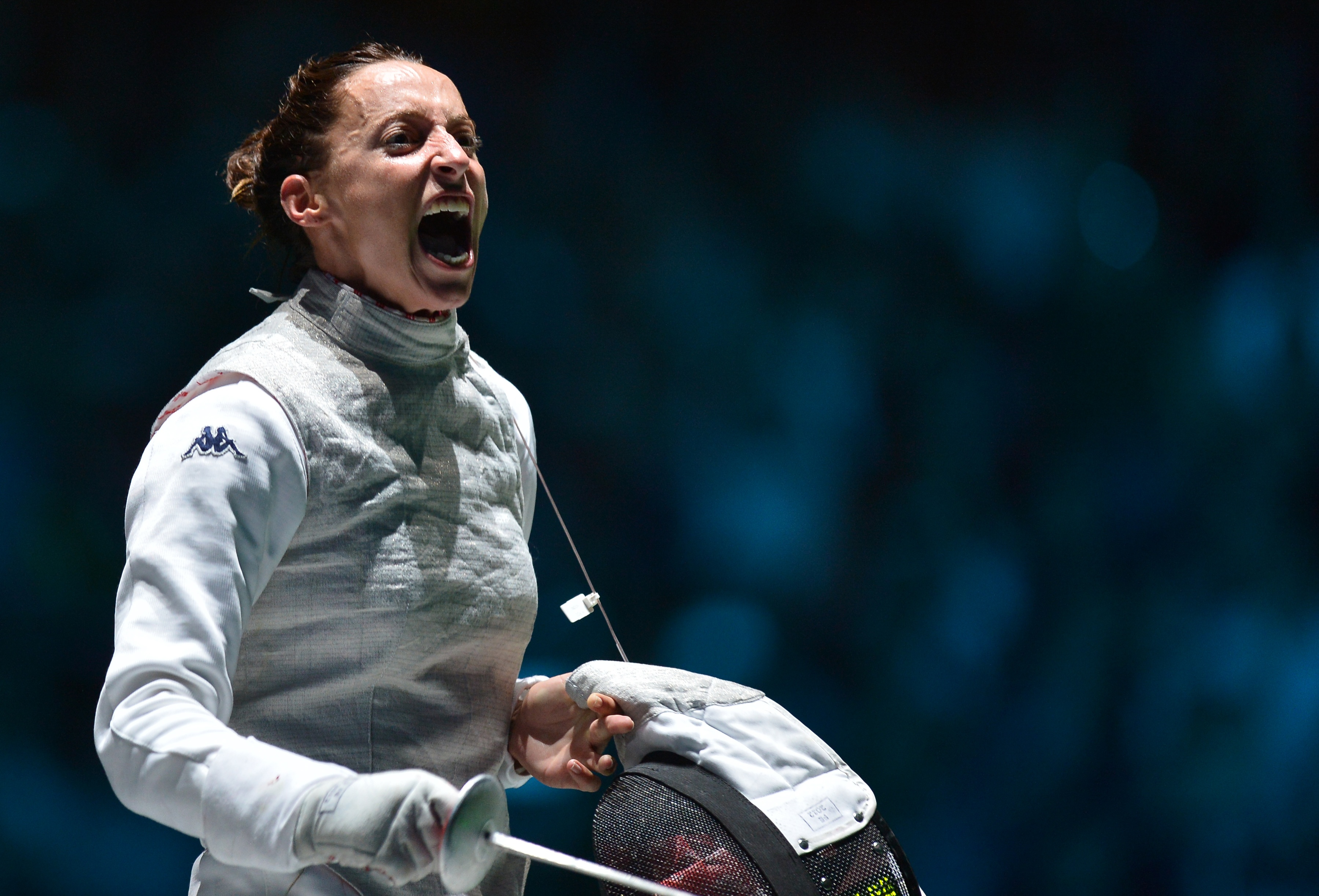 Italy's Elisa Di Francisca celebrates her victory over Italy's Arianna Errigo at the end of their women's foil gold medal fencing bout as part of the London 2012 Olympic games, on July 28, 2012 at the ExCel centre in London. AFP PHOTO / ALBERTO PIZZOLI (Photo credit should read ALBERTO PIZZOLI/AFP/GettyImages)