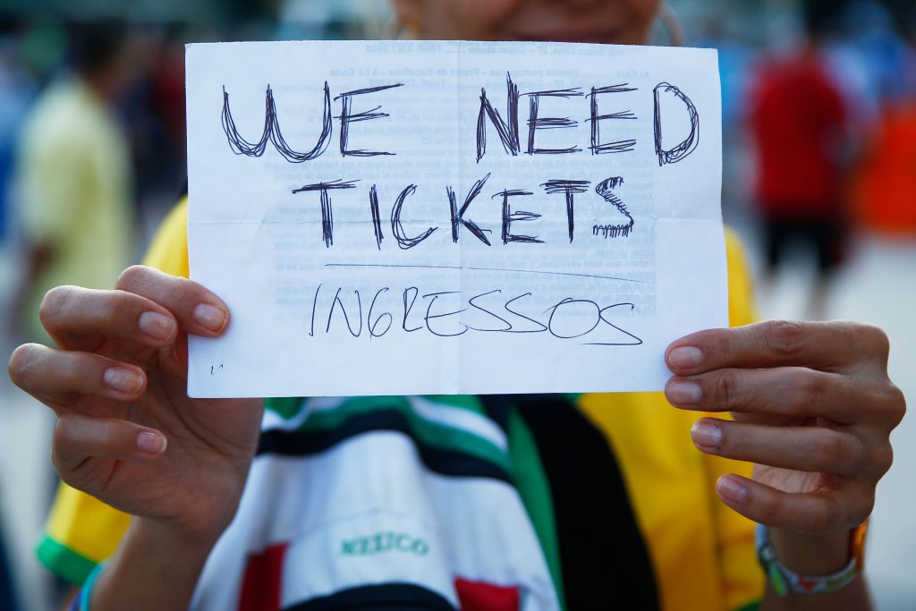 RIO DE JANEIRO, BRAZIL - JUNE 15: A fan holds a 'We Need Tickets' sign prior to the 2014 FIFA World Cup Brazil Group F match between Argentina and Bosnia-Herzegovina at Maracana on June 15, 2014 in Rio de Janeiro, Brazil. (Photo by Clive Rose/Getty Images)