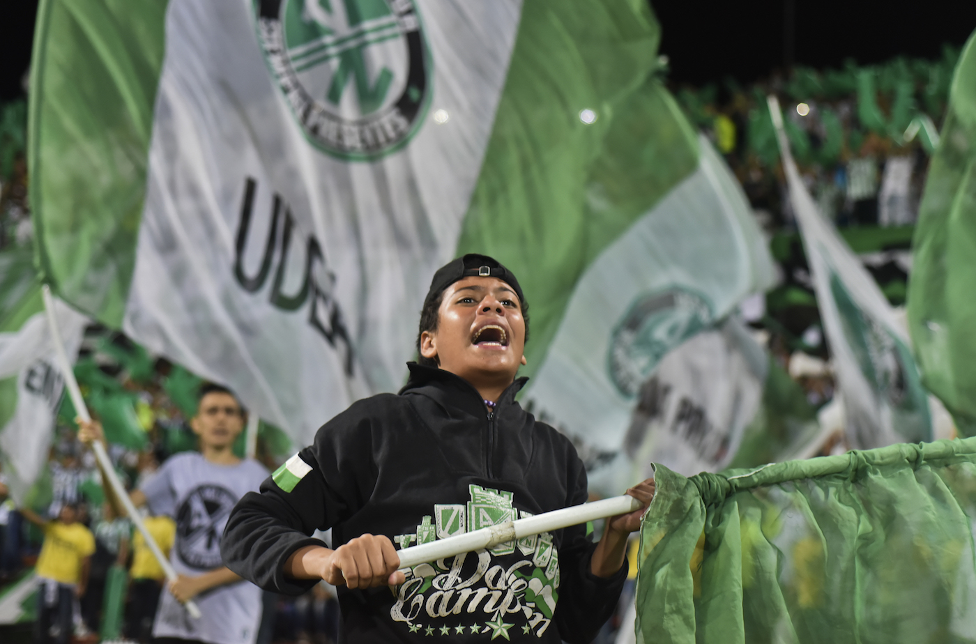 Colombia's Atletico Nacional supporters cheer for their team during the Copa Libertadores 2016 football match at the Atanasio Girardot stadium in Medellin, Colombia on May 19, 2016. / AFP / LUIS ACOSTA (Photo credit should read LUIS ACOSTA/AFP/Getty Images)