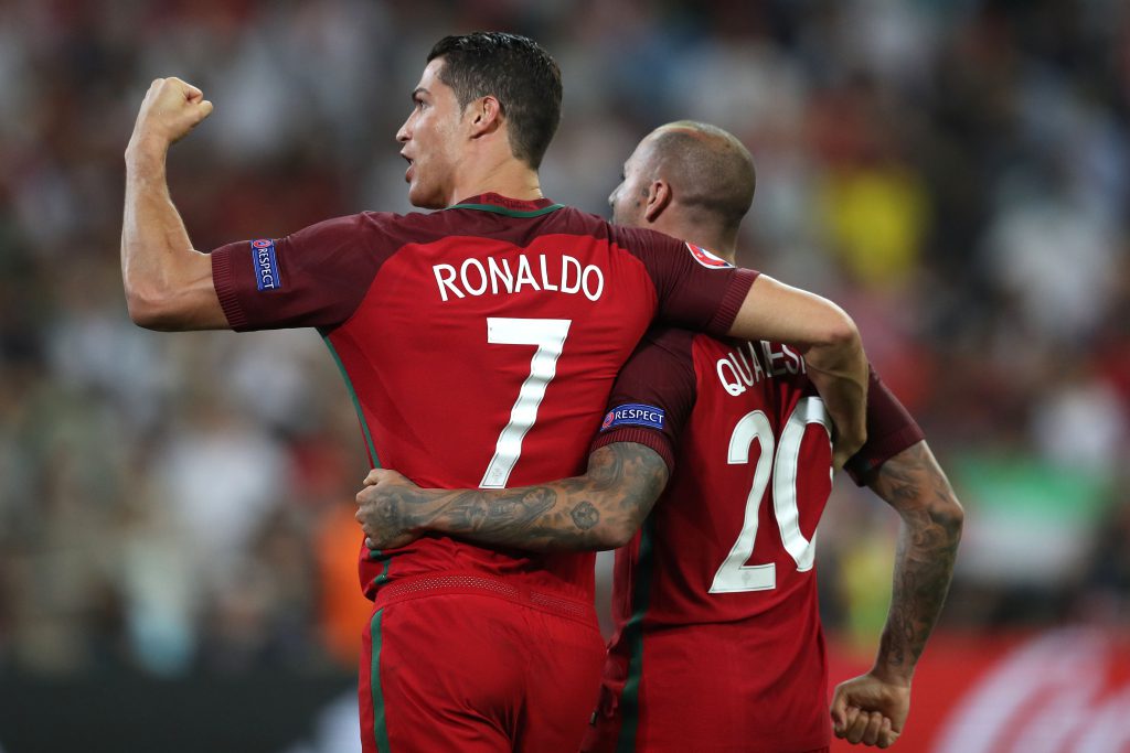 Portugal's forward Cristiano Ronaldo and Portugal's forward Ricardo Quaresma celebrate after winning the Euro 2016 quarter-final football match between Poland and Portugal at the Stade Velodrome in Marseille on June 30, 2016. / AFP / Valery HACHE (Photo credit should read VALERY HACHE/AFP/Getty Images)