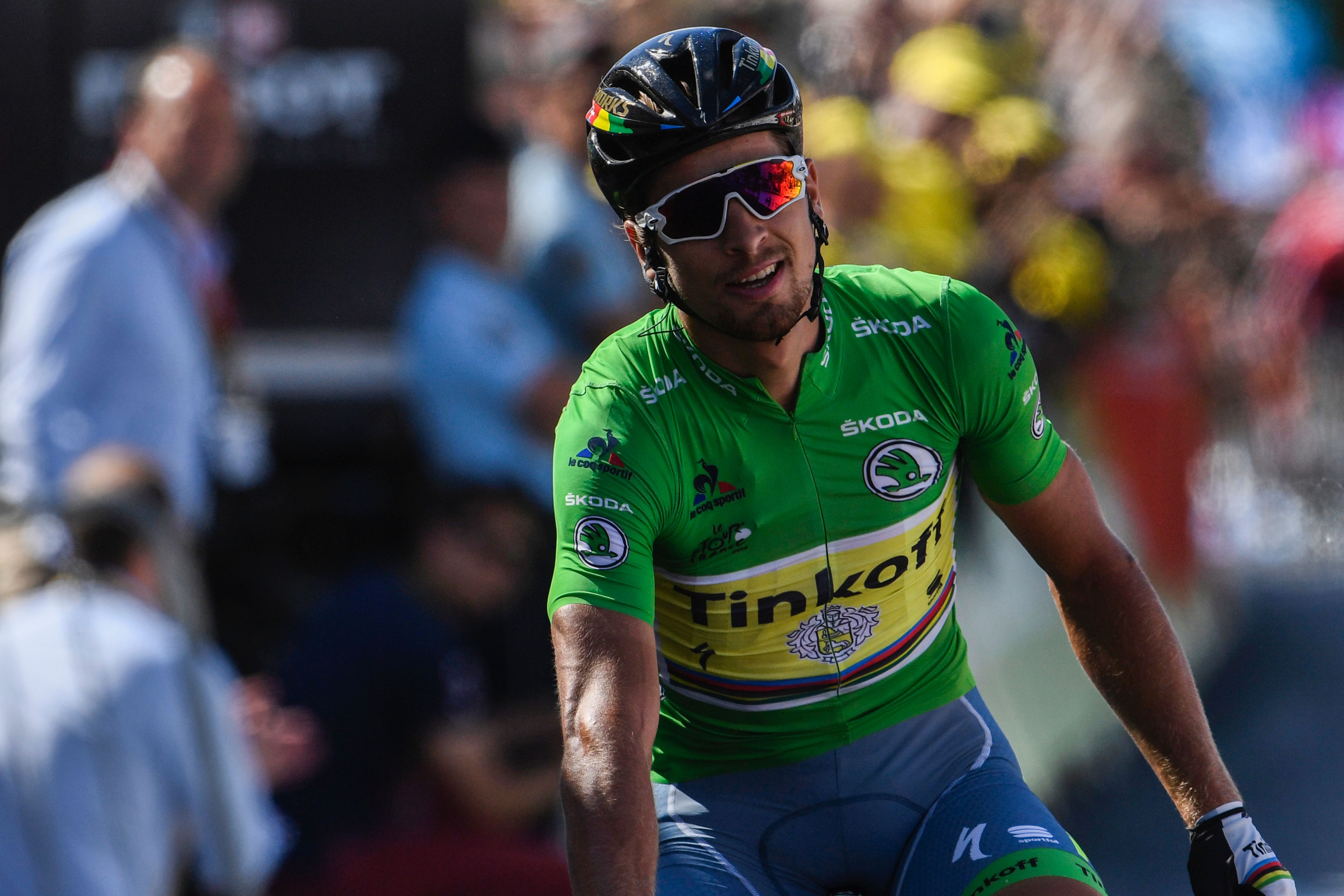 Slovakia's Peter Sagan, wearing the best sprinter's green jersey, celebrates as he crosses the finish line at the end of the 162,5 km eleventh stage of the 103rd edition of the Tour de France cycling race on July 13, 2016 between Carcassonne and Montpellier. / AFP / LIONEL BONAVENTURE (Photo credit should read LIONEL BONAVENTURE/AFP/Getty Images)