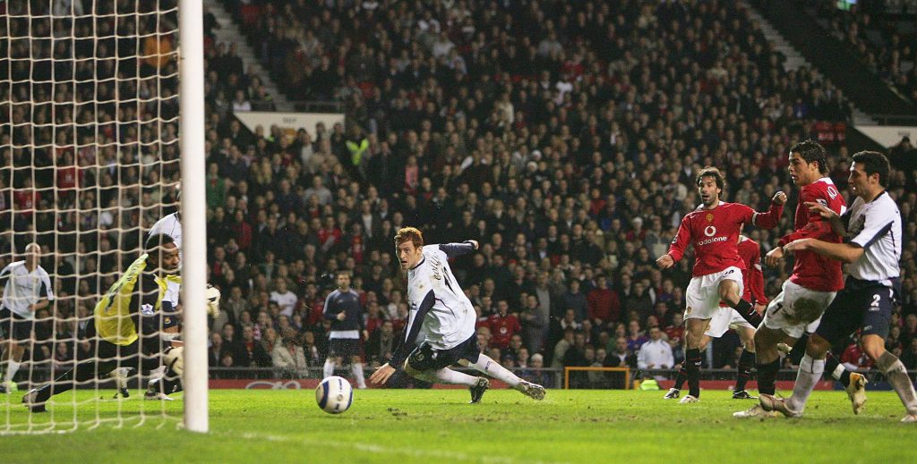 MANCHESTER, UNITED KINGDOM - MARCH 29: Ruud van Nistelrooy of Manchester United scores the opening goal past Shaka Hislop of West Ham during the Barclays Premiership match between Manchester United and West Ham United at Old Trafford on March 29, 2006 in Manchester, England. (Photo by Laurence Griffiths/Getty Images)