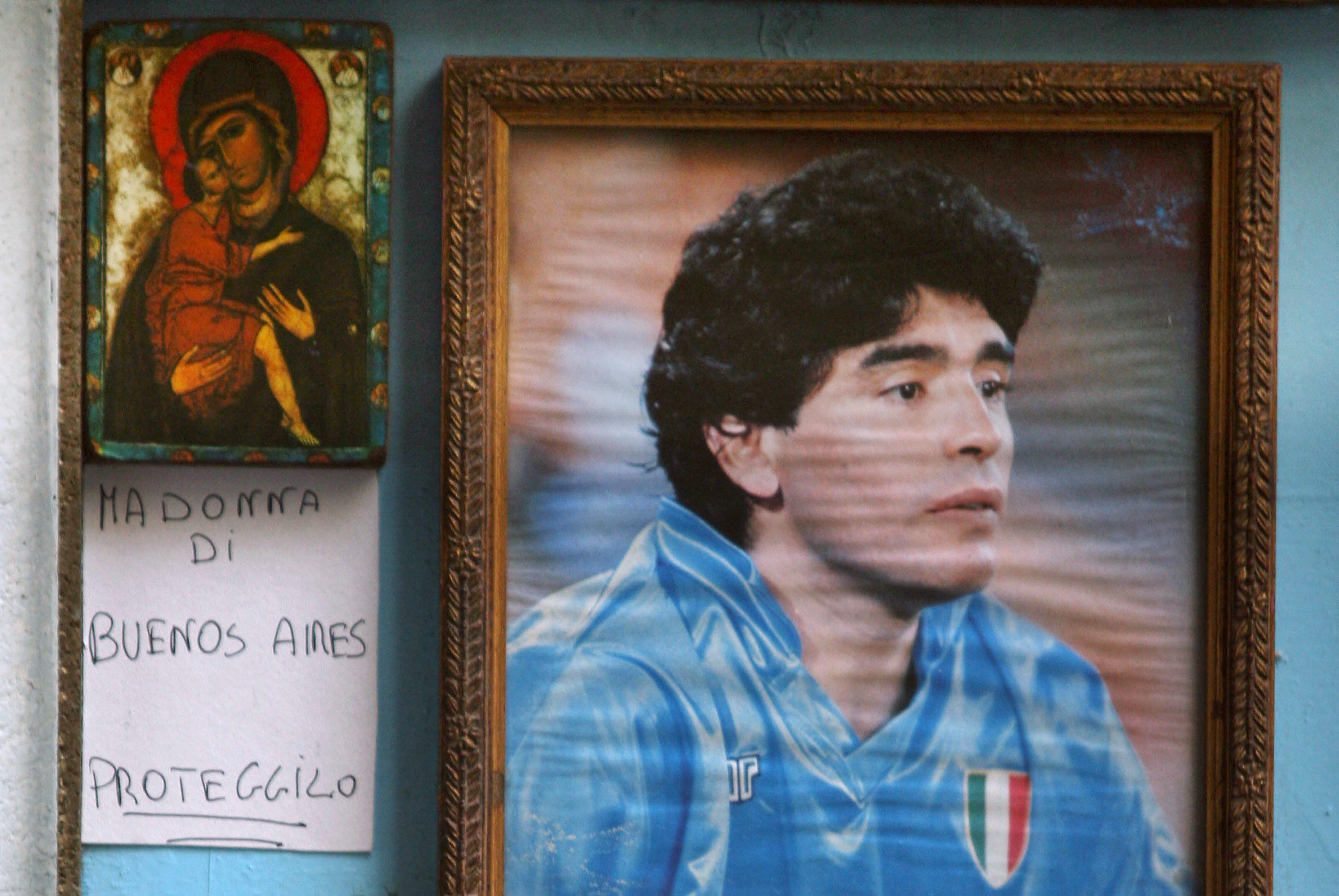 Naples, ITALY: Picture of an altar in tribute for famous Argentine star Diego Maradona, in a street of Naples, 16 April 2007. The football idol Diego Maradona was rushed to emergency, 13 April 2007, just two days after being discharged from a different facility after 13 days of treatment for excessive drinking which sparked a return of the chronic hepatitis he has suffered for years. AFP PHOTO/Mario LAPORTA (Photo credit should read MARIO LAPORTA/AFP/Getty Images)