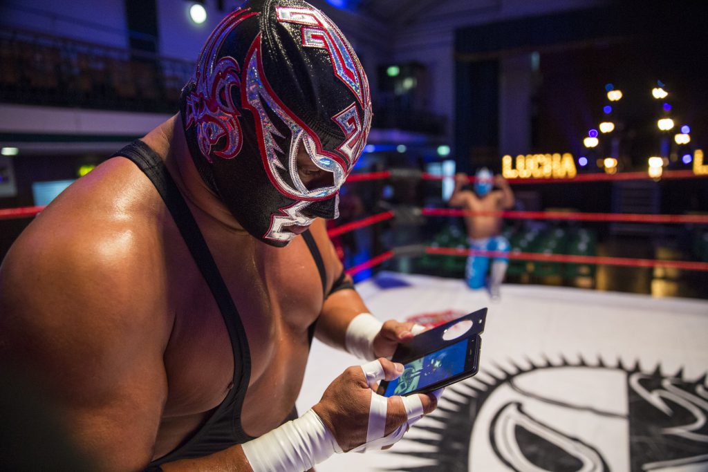 LONDON, ENGLAND - JULY 01: Professional wrestler and actor Silver King checks his phone during a photo call at York Hall in Bethnal Green on July 1, 2016 in London, England. A number of luchadores will perform in 'The Greatest Spectacle of Lucha Libre', which takes place over two days and features Mexican and British stars from the world of Mexican Wrestling. (Photo by Jack Taylor/Getty Images)