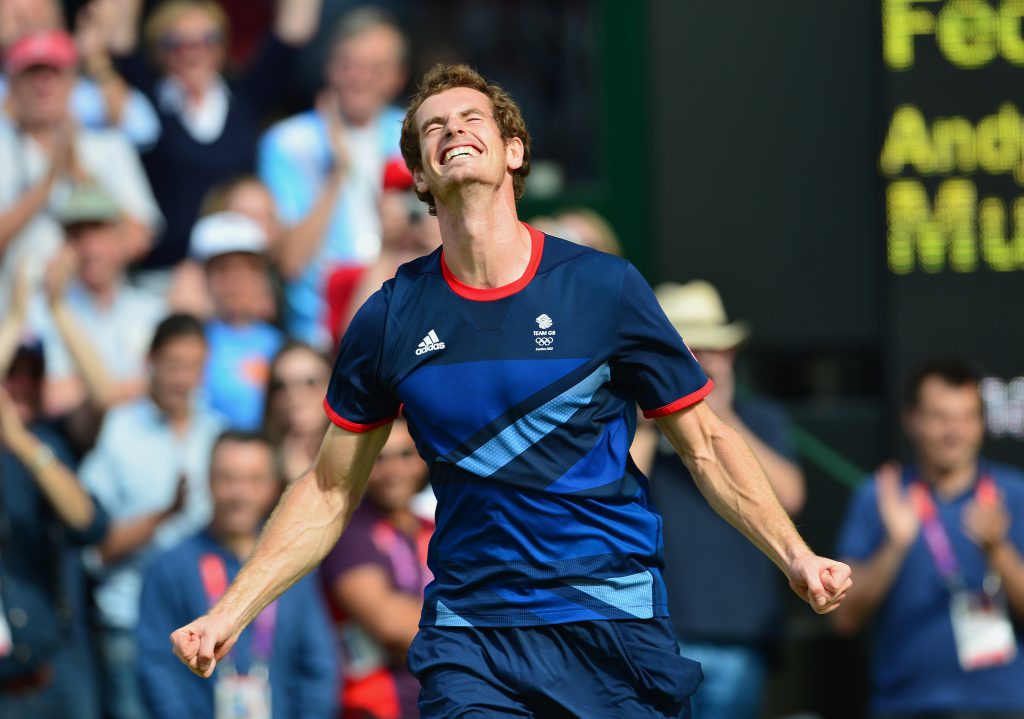 Great Britain's Andy Murray celebrates after winning the men's singles gold medal match of the London 2012 Olympic Games by defeating Switzerland's Roger Federer, at the All England Tennis Club in Wimbledon, southwest London, on August 5, 2012.   AFP PHOTO / MARTIN BERNETTI        (Photo credit should read MARTIN BERNETTI/AFP/GettyImages)