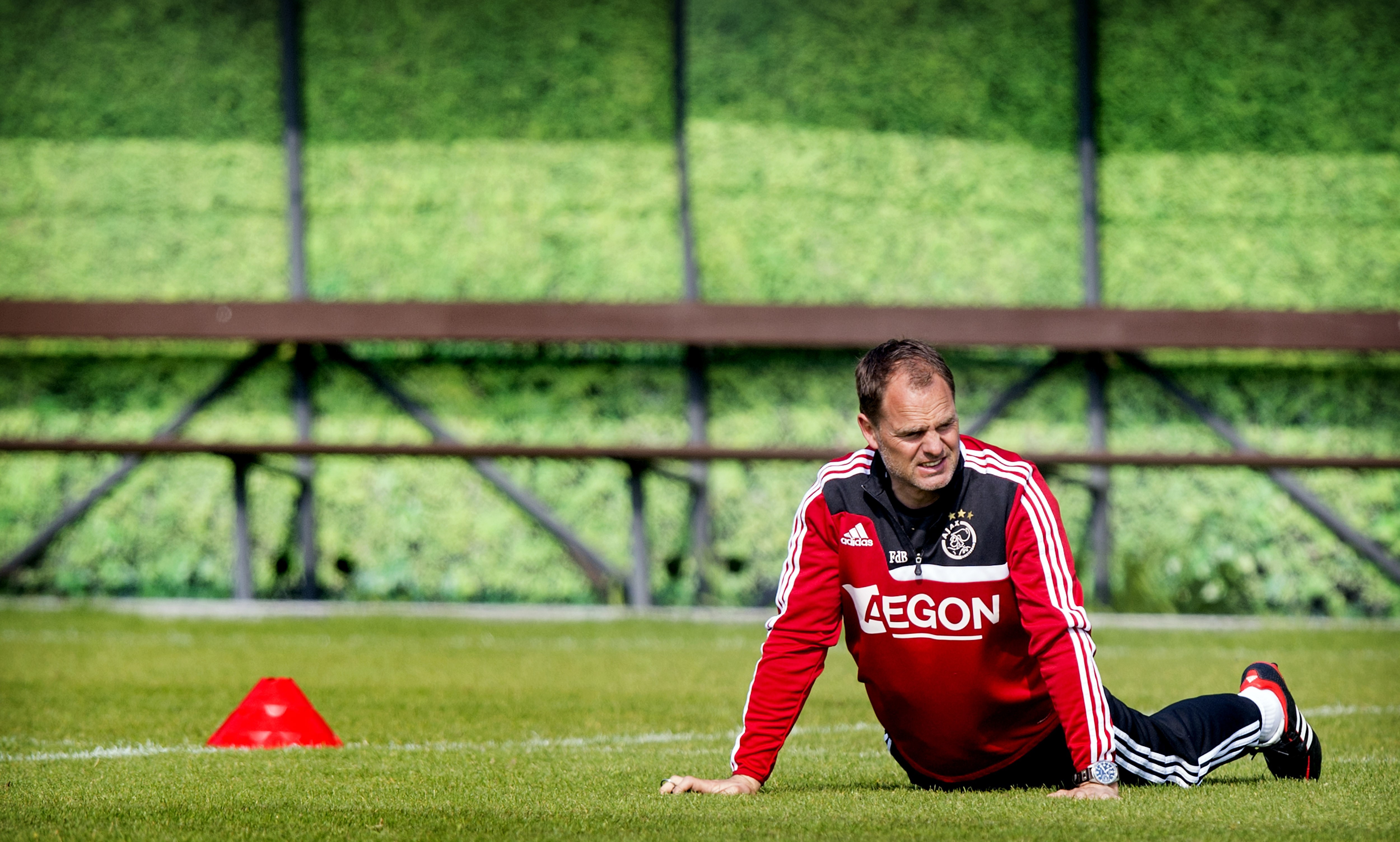 Ajax Amsterdam's head coach Frank de Boer warms up during a training session of the football team in Amsterdam, on April 25, 2014. Ajax will face Heracles Almelo on April 27. Ajax leads the Dutch First League. AFP PHOTO / ANP KOEN VAN WEEL - Netherlands out - Belgium out (Photo credit should read Koen van Weel/AFP/Getty Images)