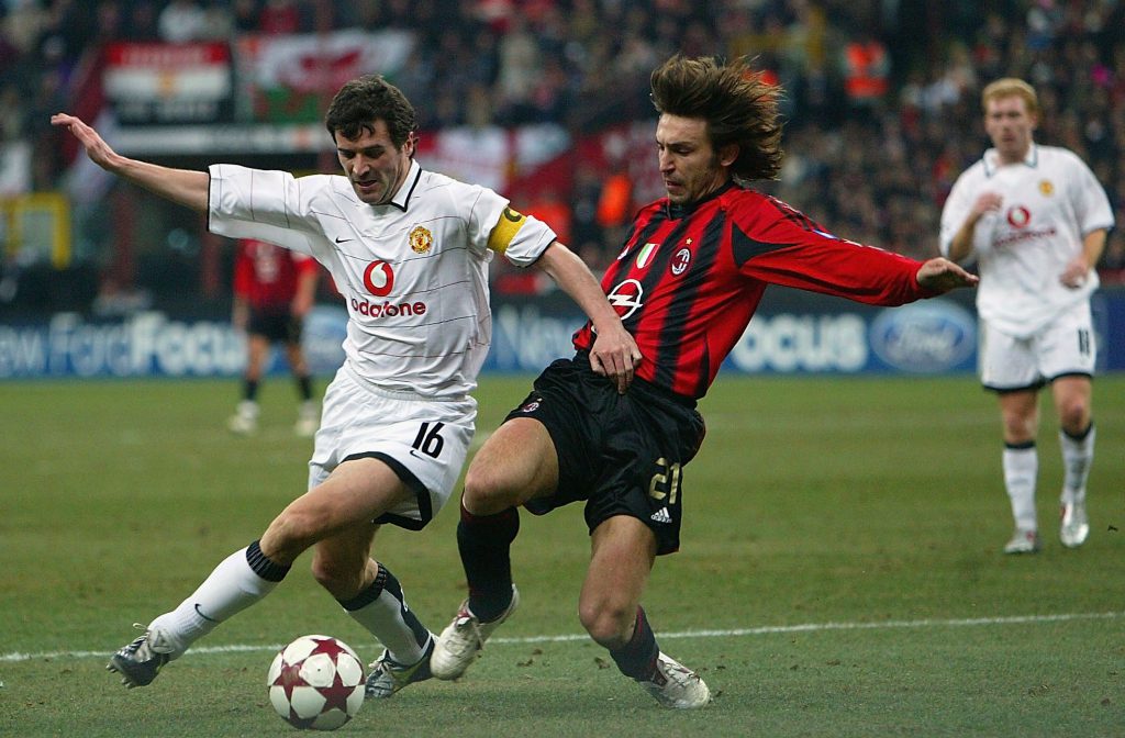 MILAN, ITALY - MARCH 8: Roy Keane of Manchester United and Andrea Pirlo of Milan tussle in the Penalty box during the Champions League last 16, second leg match between Milan and Manchester United at the San Siro on March 8, 2005 in Milan, Italy. (Photo by Phil Cole/Getty Images)