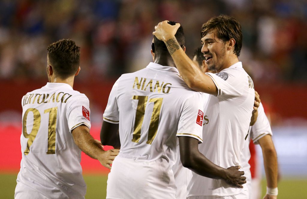 Alessio Cerci #11 celebrates his goal with Alessio Romagnoli #13 AC Milan against FC Bayern Munich at the International Champions Cup on July 27, 2016 at Solider Field Stadium in Chicago, Illinois. / AFP / Tasos Katopodis (Photo credit should read TASOS KATOPODIS/AFP/Getty Images)