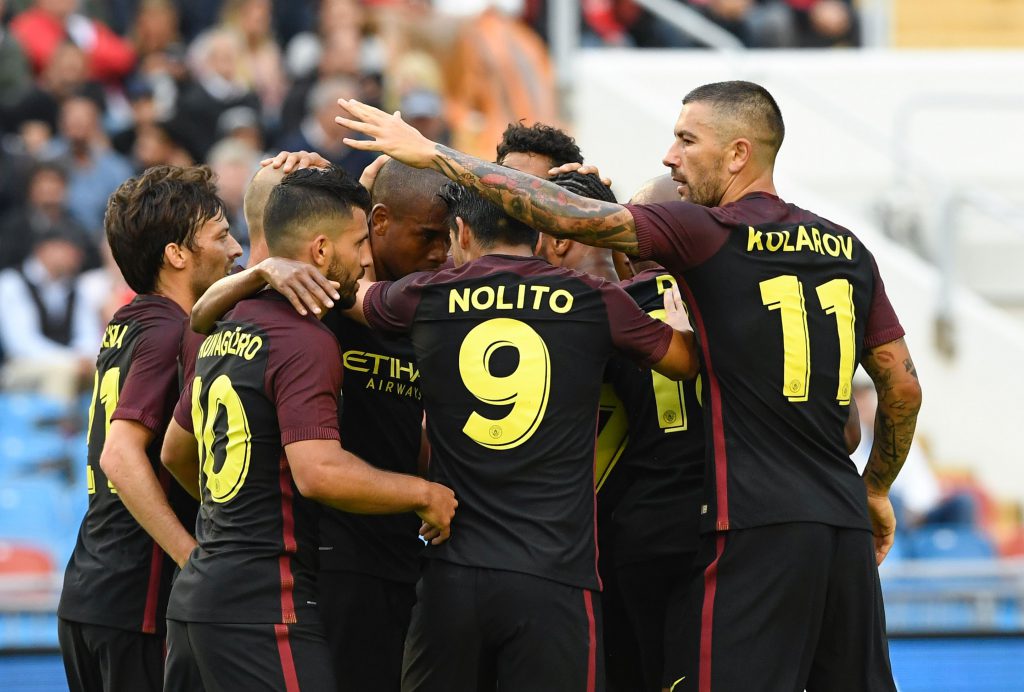 Manchester City's Argentinian forward Sergio Aguero (2nd L) celebrates with his teammates after scoring during the friendly football match between Arsenal and Manchester City at the Ullevi stadium in Gothenburg on August 7, 2016. / AFP / JONATHAN NACKSTRAND (Photo credit should read JONATHAN NACKSTRAND/AFP/Getty Images)