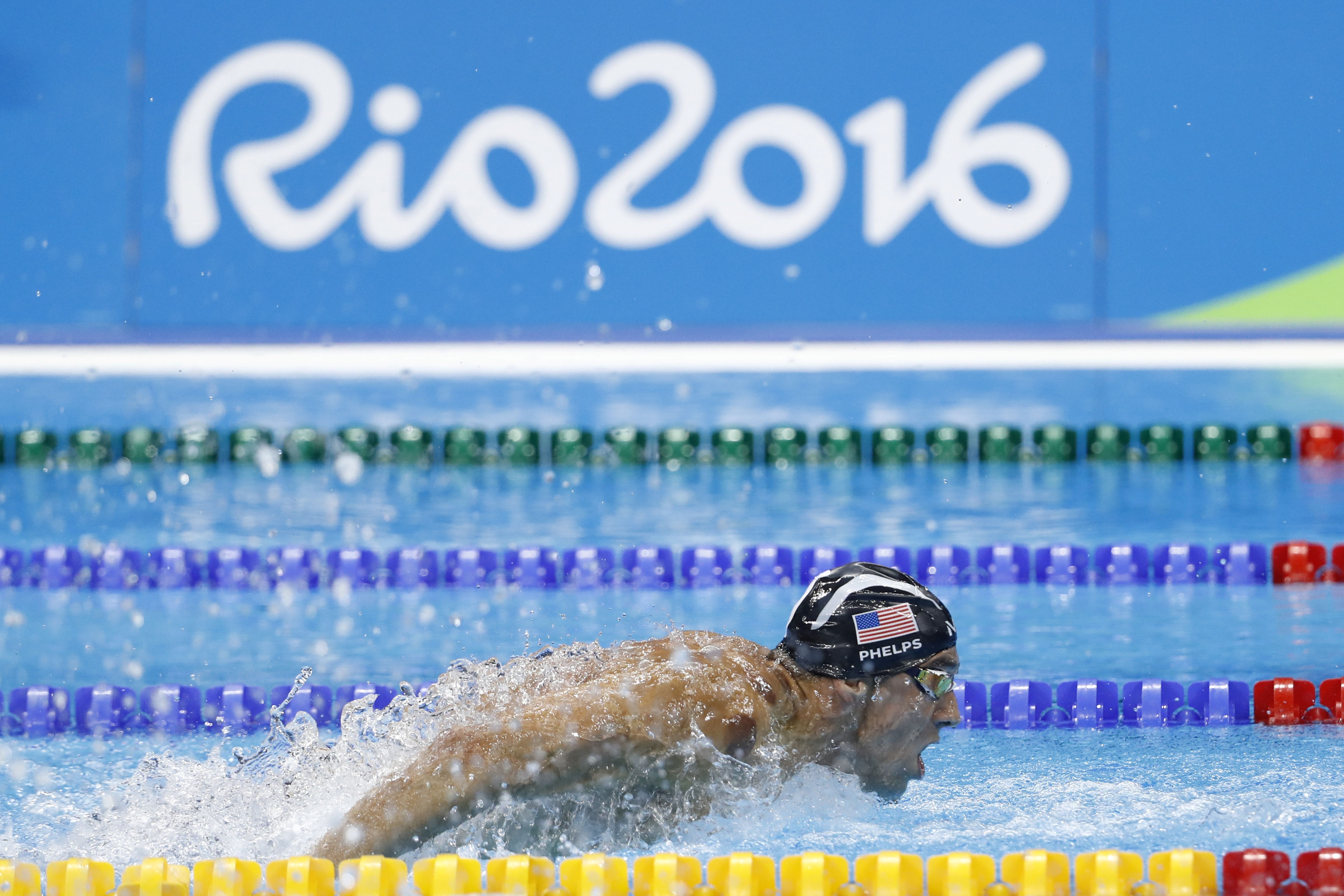 TOPSHOT - USA's Michael Phelps competes in the Men's 200m Butterfly Semifinal during the swimming event at the Rio 2016 Olympic Games at the Olympic Aquatics Stadium in Rio de Janeiro on August 8, 2016. / AFP / Odd Andersen (Photo credit should read ODD ANDERSEN/AFP/Getty Images)