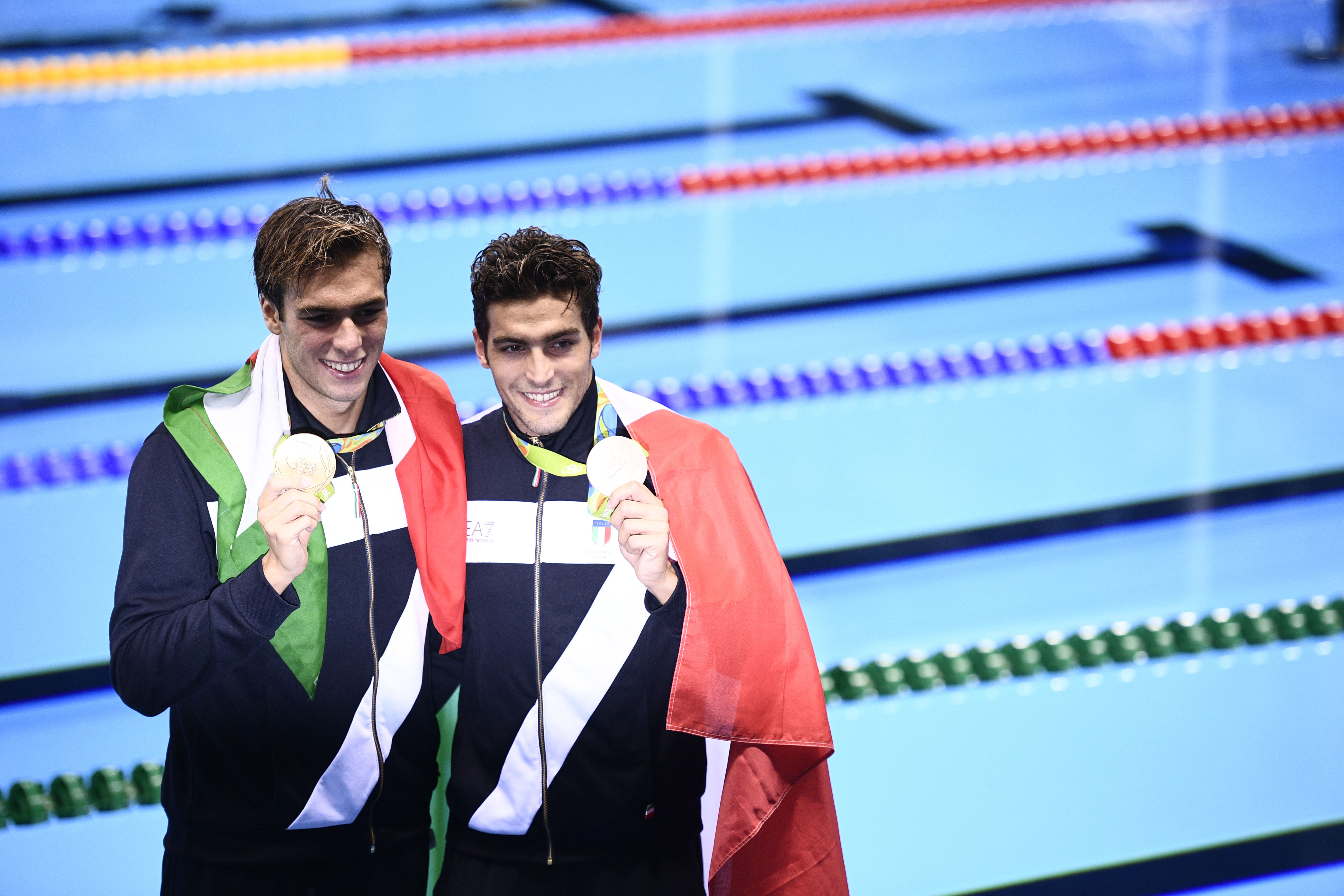 Italy's gold medallist Gregorio Paltrinieri and Italy's bronze Gabriele Detti (R) pose on the podium after the Men's swimming 1500m Freestyle Final at the Rio 2016 Olympic Games at the Olympic Aquatics Stadium in Rio de Janeiro on August 13, 2016. / AFP / Martin BUREAU (Photo credit should read MARTIN BUREAU/AFP/Getty Images)