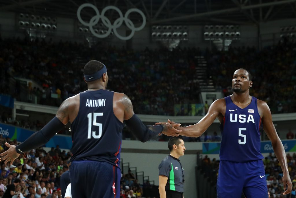 RIO DE JANEIRO, BRAZIL - AUGUST 19: Carmelo Anthony #15 and Kevin Durant #5 of United States celebrate a play against Spain during the Men's Semifinal match on Day 14 of the Rio 2016 Olympic Games at Carioca Arena 1 on August 19, 2016 in Rio de Janeiro, Brazil. (Photo by Christian Petersen/Getty Images)