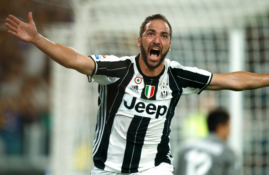 Juventus' Argentinian forward Gonzalo Higuain celebrates after scoring during the Italian Serie A football match Juventus versus Fiorentina on August 20, 2016 at the 'Juventus Stadium' in Turin. / AFP / MARCO BERTORELLO (Photo credit should read MARCO BERTORELLO/AFP/Getty Images)