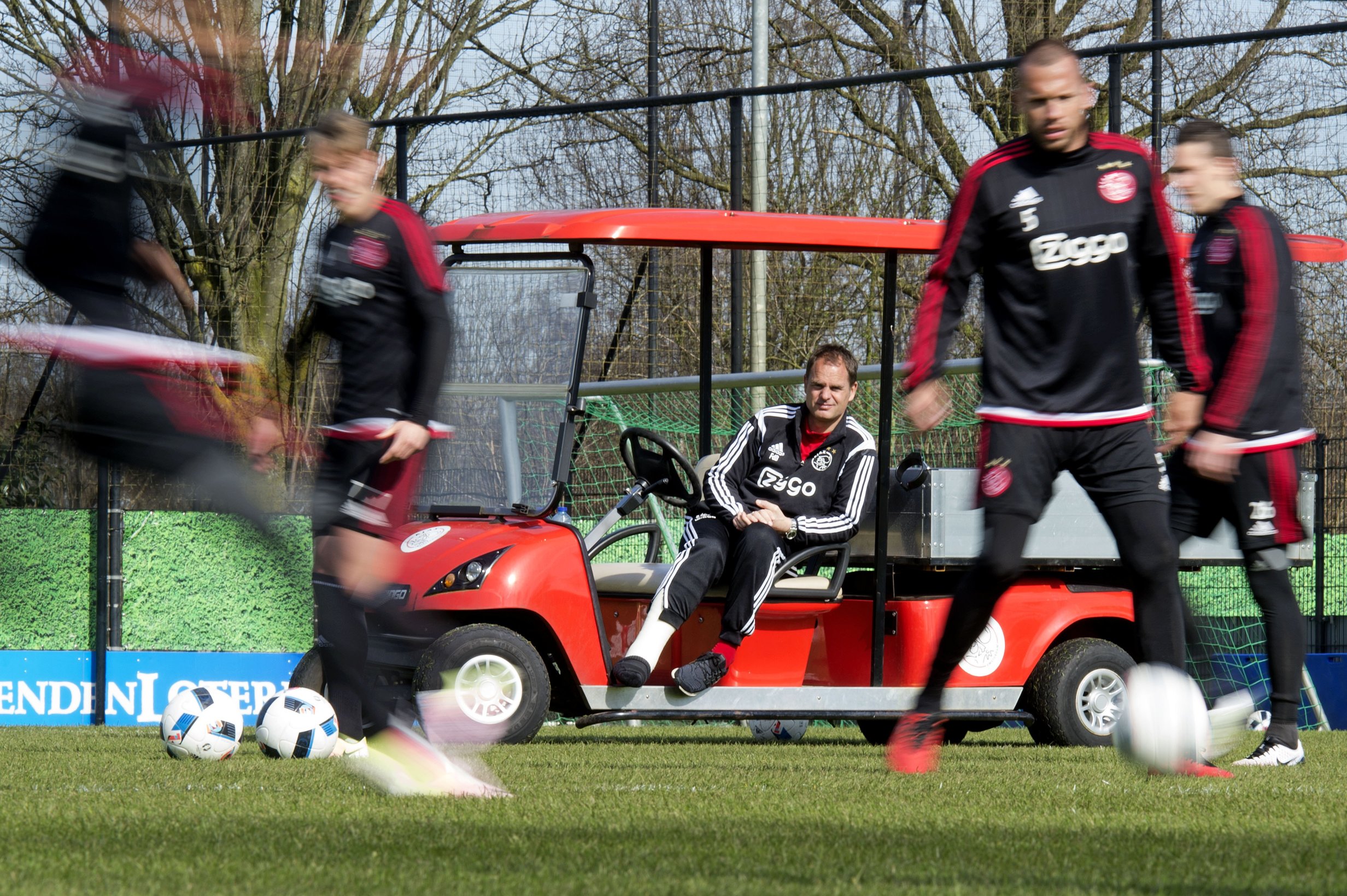 Ajax Amsterdam's head coach Frank De Boer, sitting on a golf cart because of a rupture of the Achilles tendon, attends the training session of his football team, in Amsterdam, on April 1, 2016. / AFP / ANP / OLAF KRAAK / Netherlands OUT (Photo credit should read OLAF KRAAK/AFP/Getty Images)