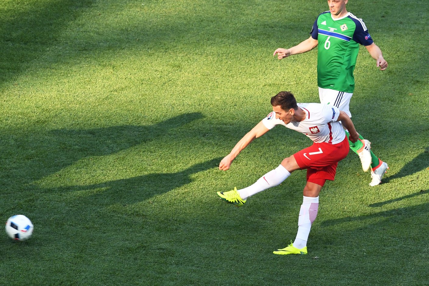 Poland's forward Arkadiusz Milik scores a goal during the Euro 2016 group C football match between Poland and Northern Ireland at the Stade de Nice in Nice on June 12, 2016. / AFP / BORIS HORVAT (Photo credit should read BORIS HORVAT/AFP/Getty Images)