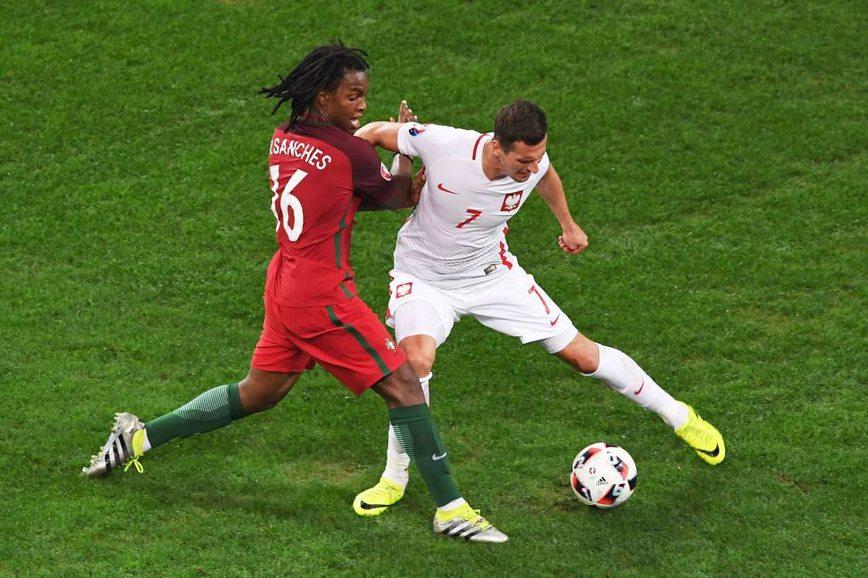 Portugal's midfielder Renato Sanches (L) vies with Poland's forward Arkadiusz Milik during the Euro 2016 quarter-final football match between Poland and Portugal at the Stade Velodrome in Marseille on June 30, 2016. / AFP / BORIS HORVAT (Photo credit should read BORIS HORVAT/AFP/Getty Images)