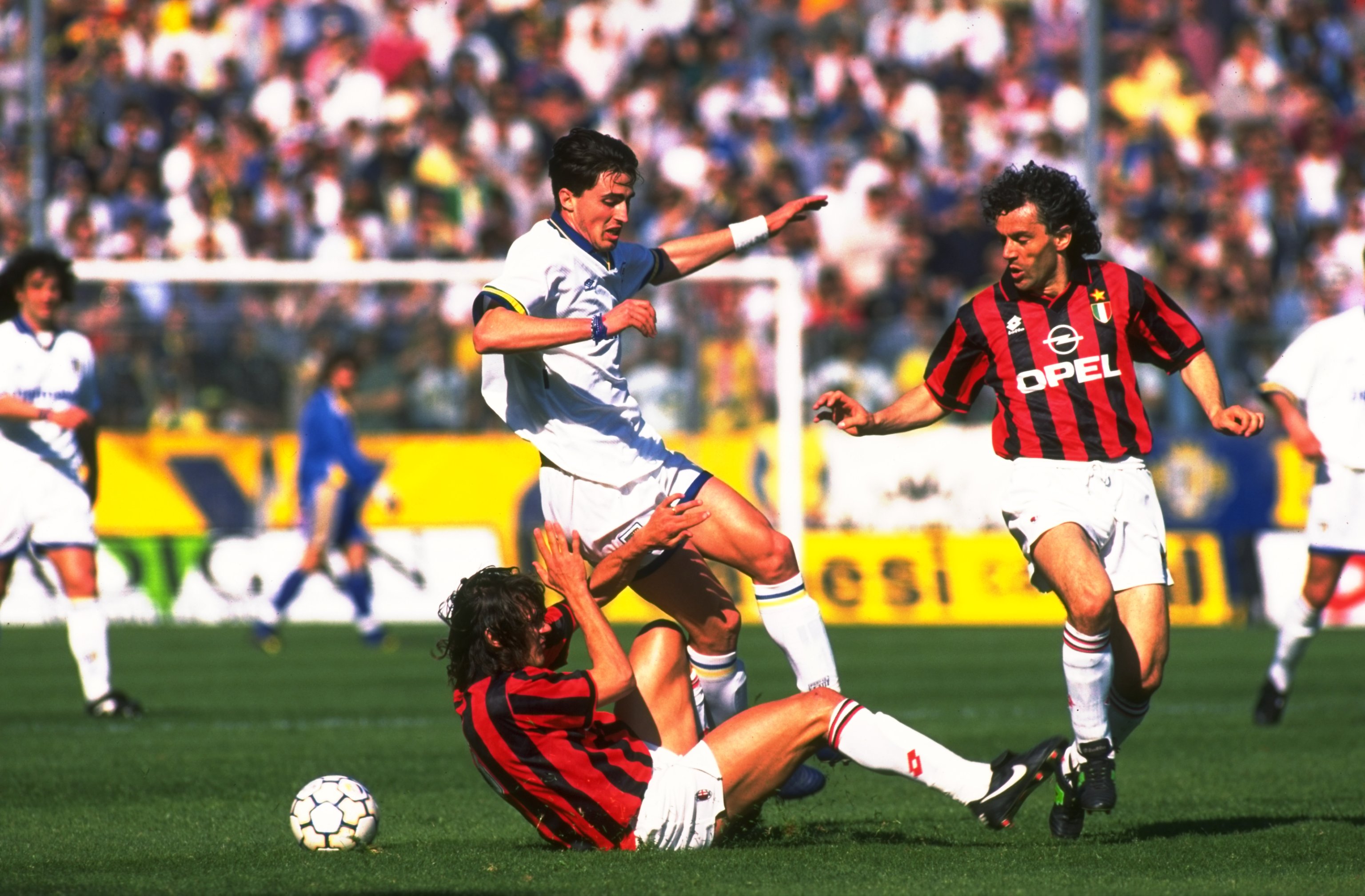 8 Apr 1995: Dino Baggio (centre) of Parma AC takes on Paolo Maldini (left) and Roberto Donadoni (right) of AC Milan during a Serie A match at the Ennio Tardini Stadium in Parma, Italy. AC Milan won the match 3-2. Mandatory Credit: Allsport UK /Allsport