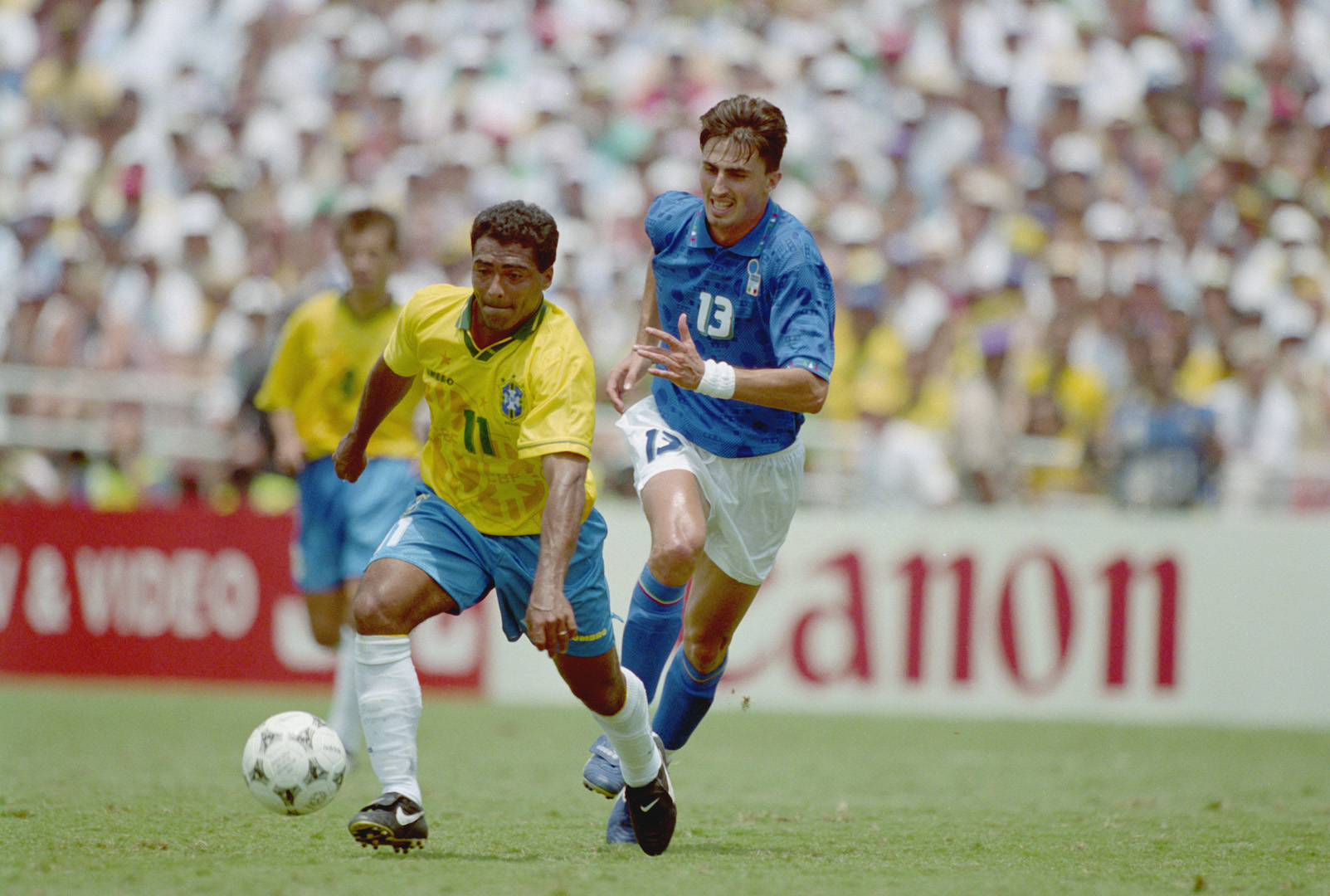 LOS ANGELES - JULY 17: Romario of Brazil takes the ball past Dino Baggio of Italy during the FIFA World Cup Finals 1994 Final between Brazil and Italy held on July 17, 1994 at the Rose Bowl, in Los Angeles, USA. The match ended in a 0-0 draw after extra-time, with Brazil winning the match and final 3-2 on penalties. (Photo by Mike Hewitt/Getty Images)