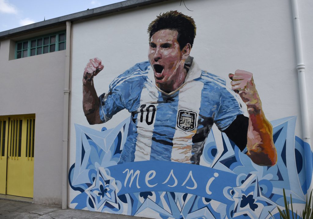 A mural of Argentine footballer Lionel Messi painted by Brazilian artist Paulo Consentino is seen on the wall of the backyard of the General Las Heras school in Rosario, some 350 km north of Buenos Aires, on August 26, 2015. AFP PHOTO / HECTOR RIO (Photo credit should read HECTOR RIO/AFP/Getty Images)